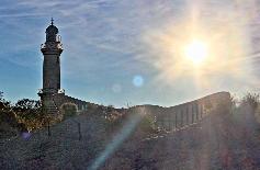 Picture: Rostock-Warnemünde old lighthouse and "Teepott". The lighthouse is still in operation and serves also as sightseeing platform for tourists.